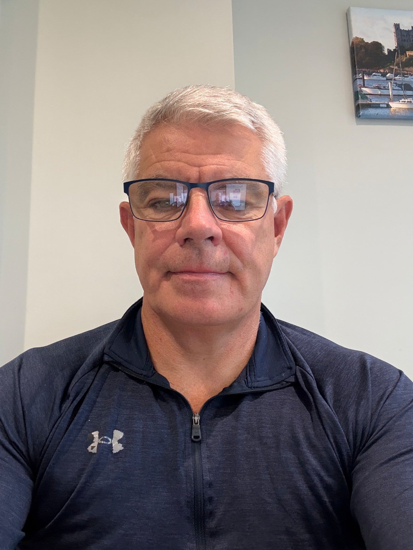 Chris Deavin, personal trainer and health coach standing in his private studio in Reigate, Surrey
